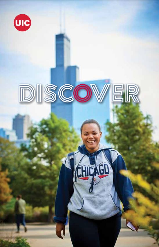 Cover page of viewbook, student smiling, walking on pathway surrounded by green trees, skyscrapers rise in the background